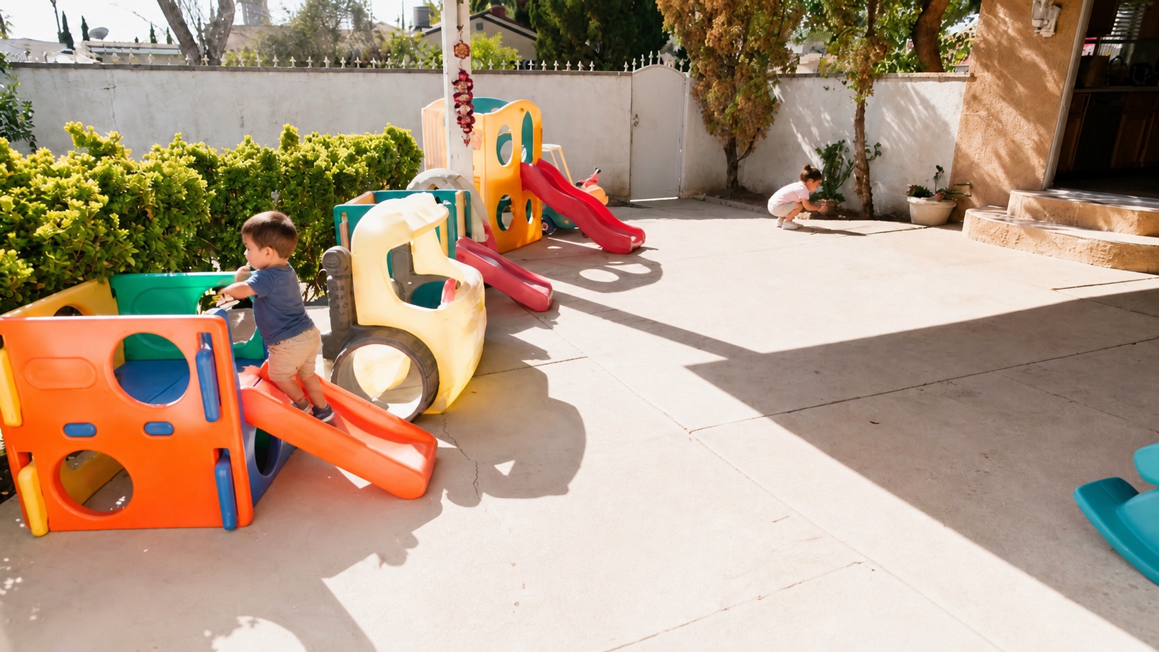 Representative children playing in the actual outdoor daycare area.